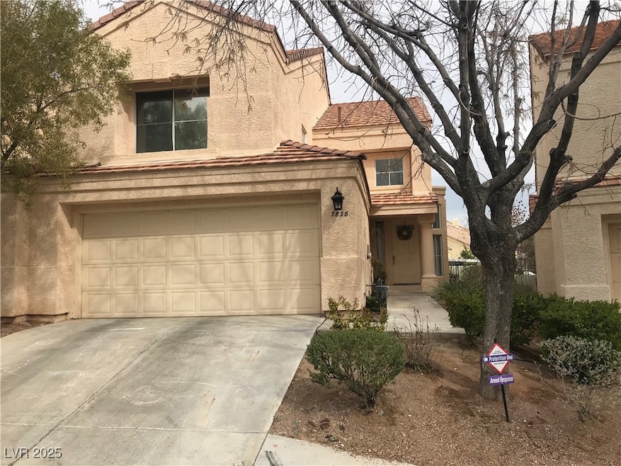 View of front of property with stucco siding, driv