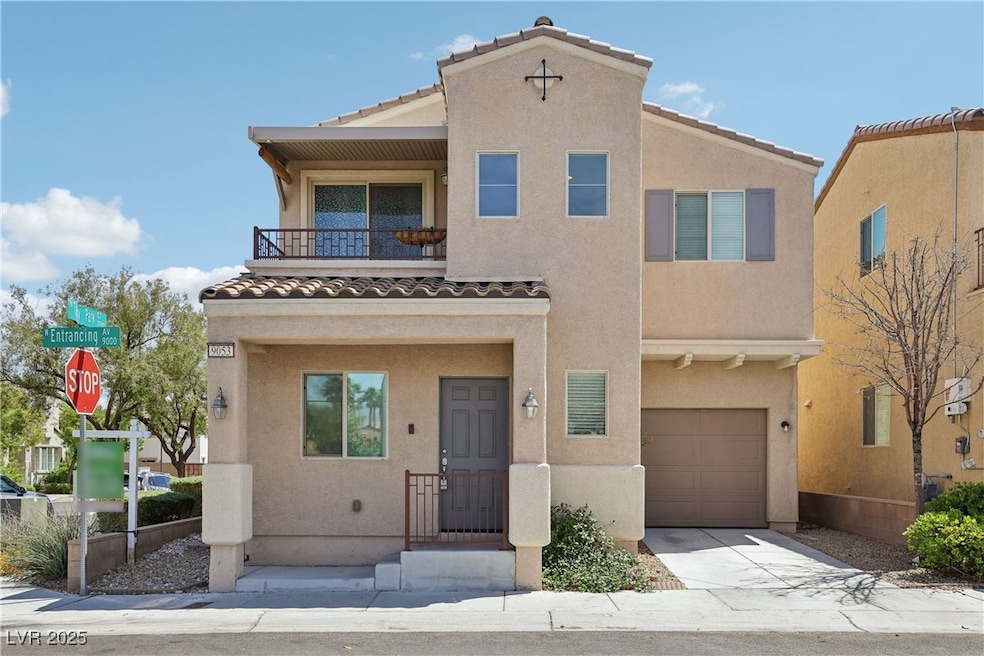 View of property featuring stucco siding and a til
