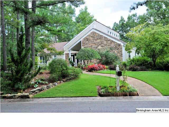 Amazing curb appeal and mature landscaping greets 
