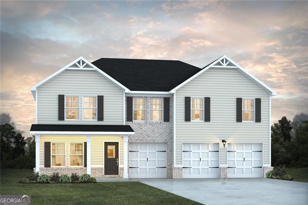 View of front of property featuring a garage and a