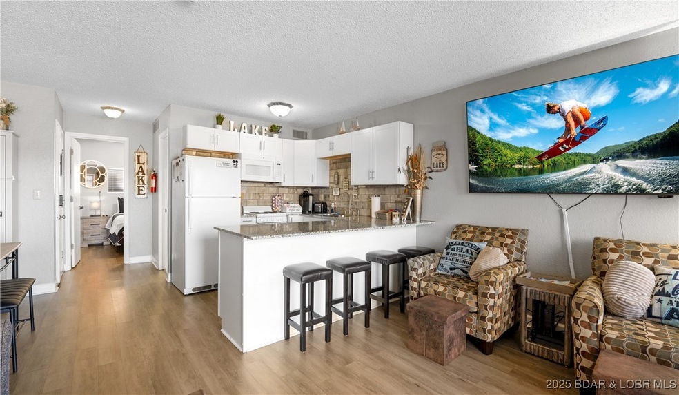 6620 Weston Point Dr unit G 11, Osage Beach, MO 65065 - photo 1