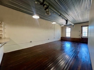 Loft living room, original hardwood floors, door t