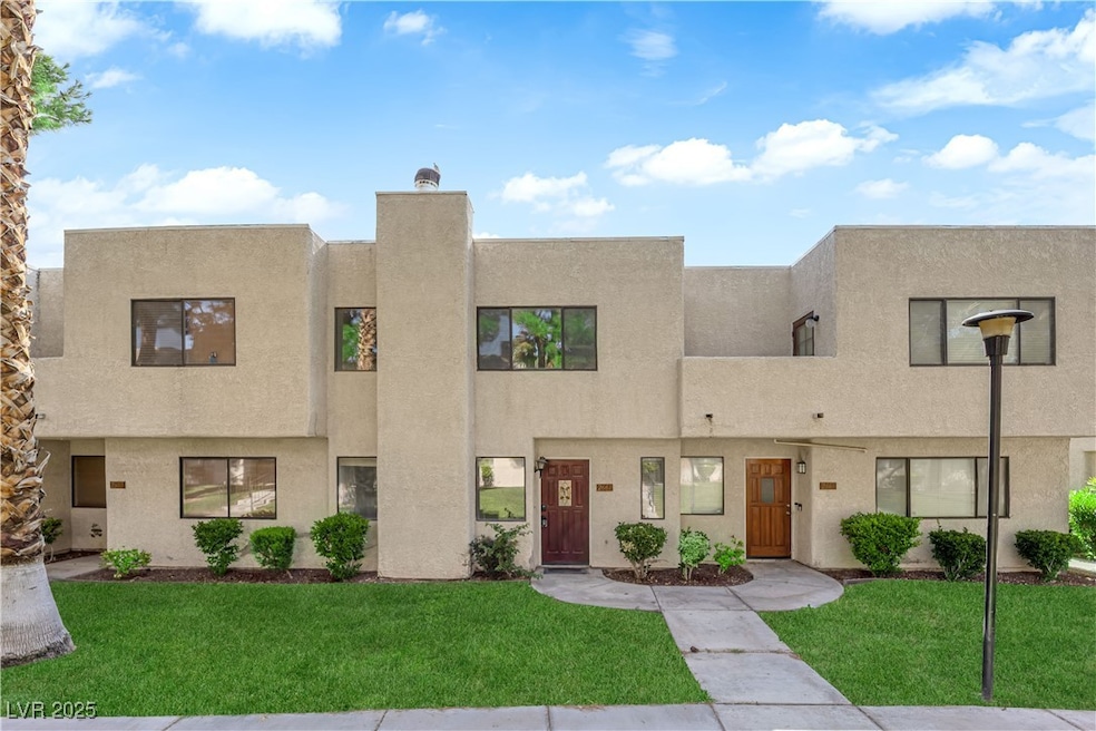 View of front of house featuring stucco siding and