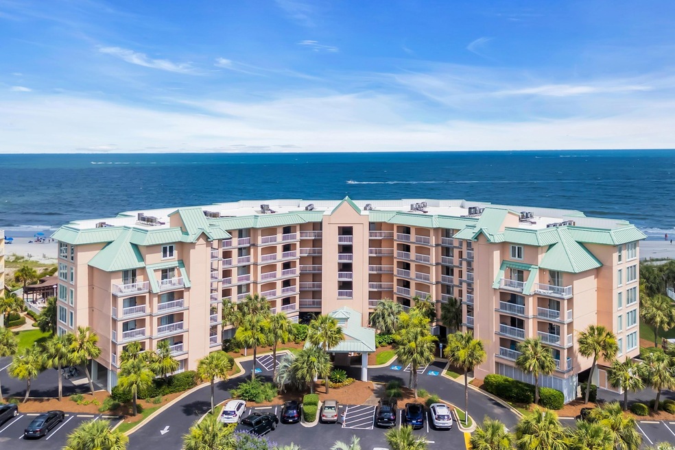 Aerial view of apartment complex and a nearby body of water