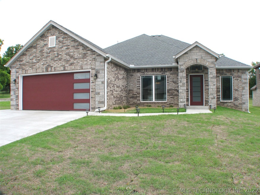 Beautiful full brick with stone accents.  On a cor