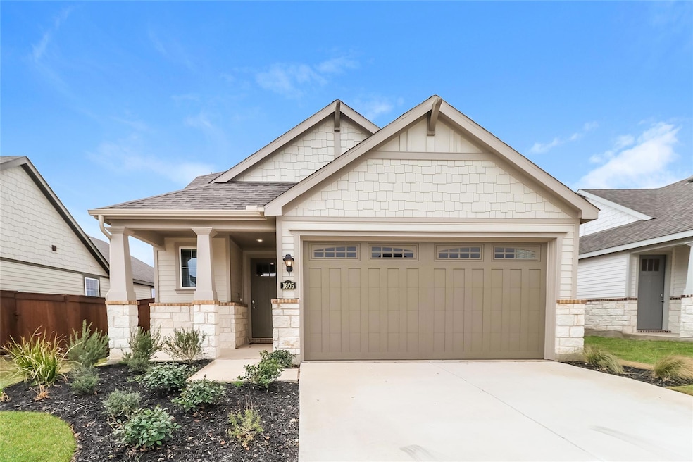 Craftsman inspired home featuring stone siding, a