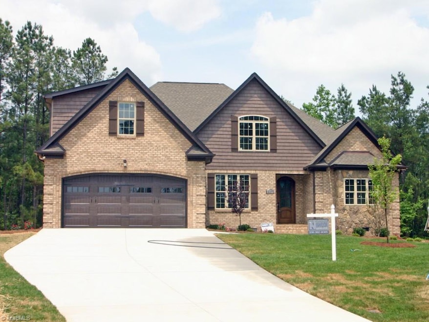 Inviting all brick home with stone accents