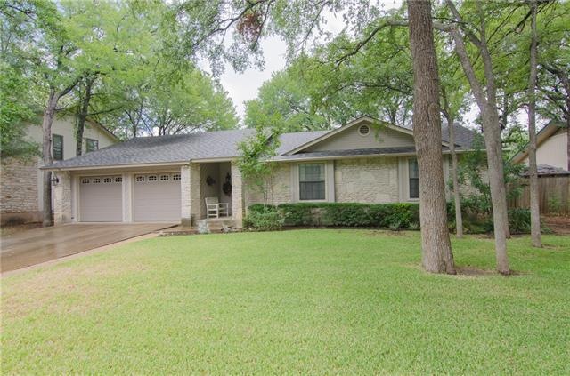 Nice stone home on large lot with huge trees!
