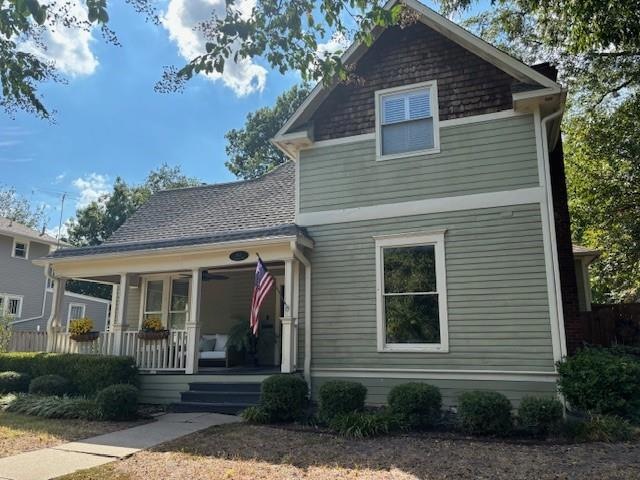 View of front property featuring a porch