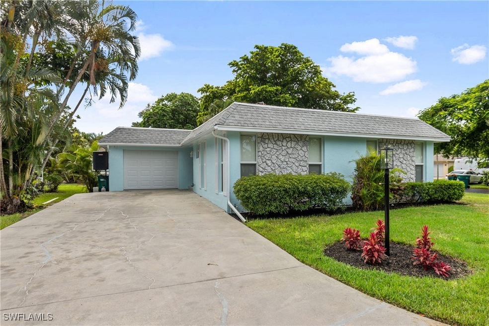 Ranch-style home with a garage and a front yard