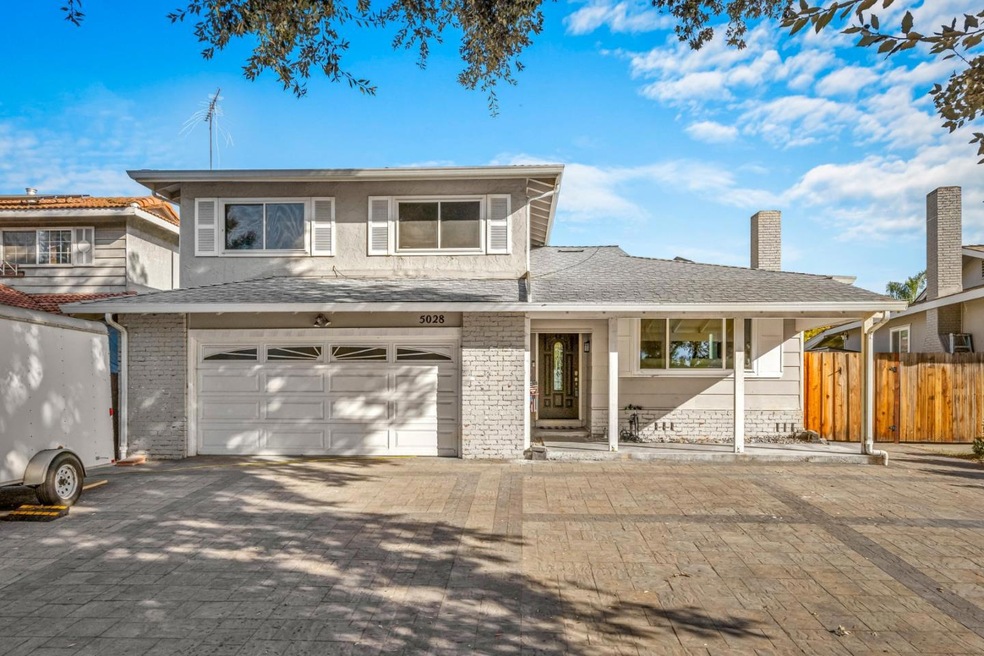 Paver driveway and front yard makes additional par