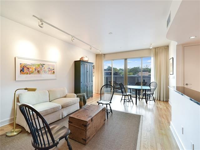 Spacious, open living area with lots of natural li