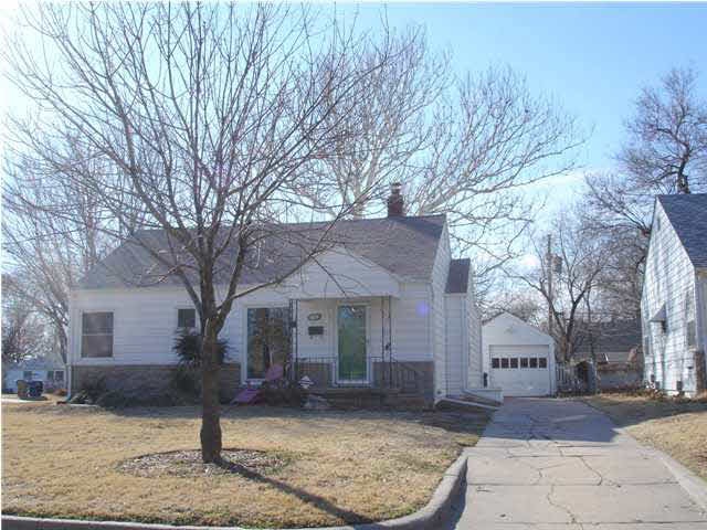 Adorable home nestled on a large corner lot in Lon