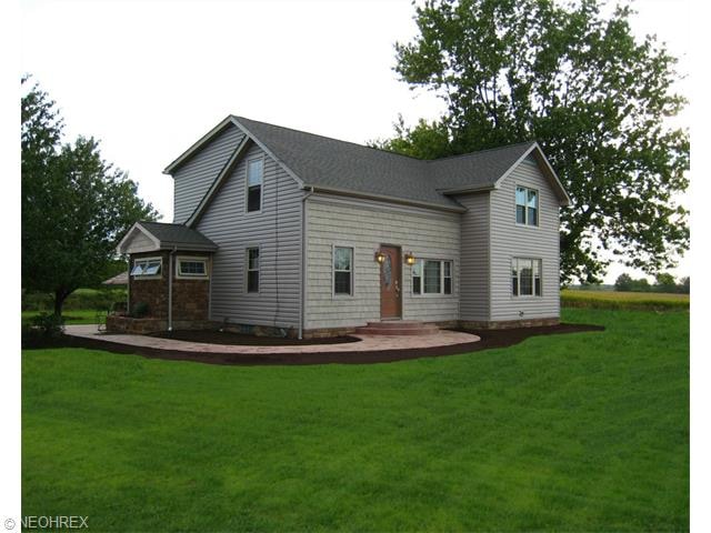 Summer picture of house. Provided by sellers.