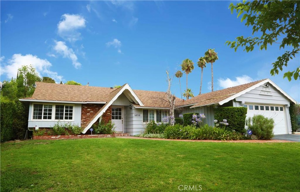 Located on a quiet tree lined street with a  beautiful approach!