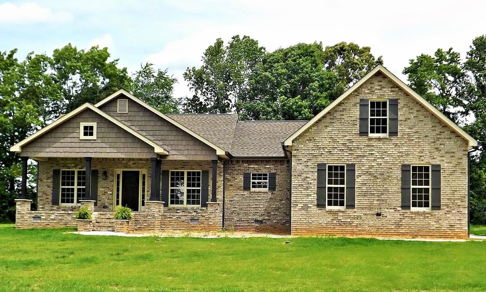 Stunning Craftsman style brick home with 3 BR/2.5 bath and Bonus room! Must see!