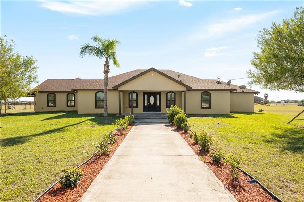 Ranch-style house with a front lawn