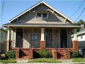 Photo. Front porch with ornamental wrought iron ra