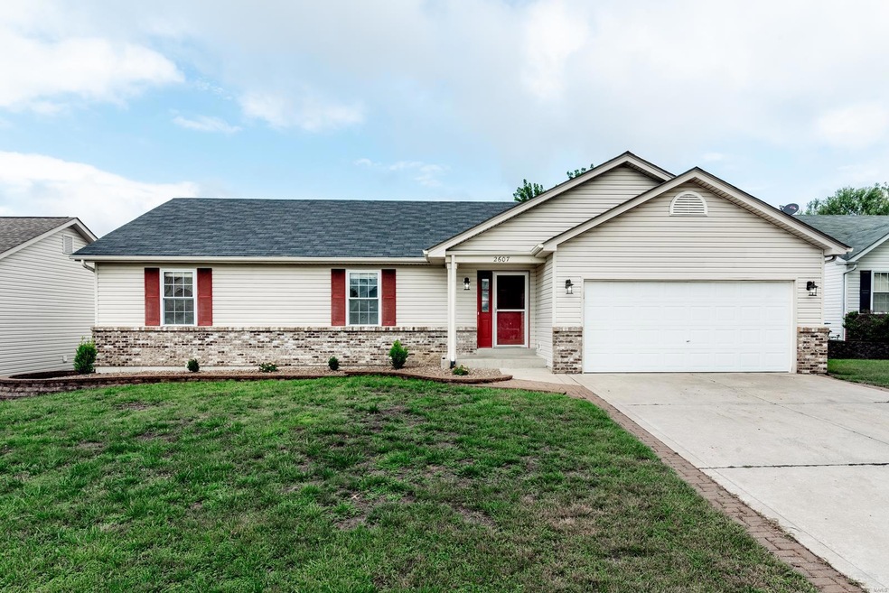 Updated landscaping and vinyl siding on this cute 