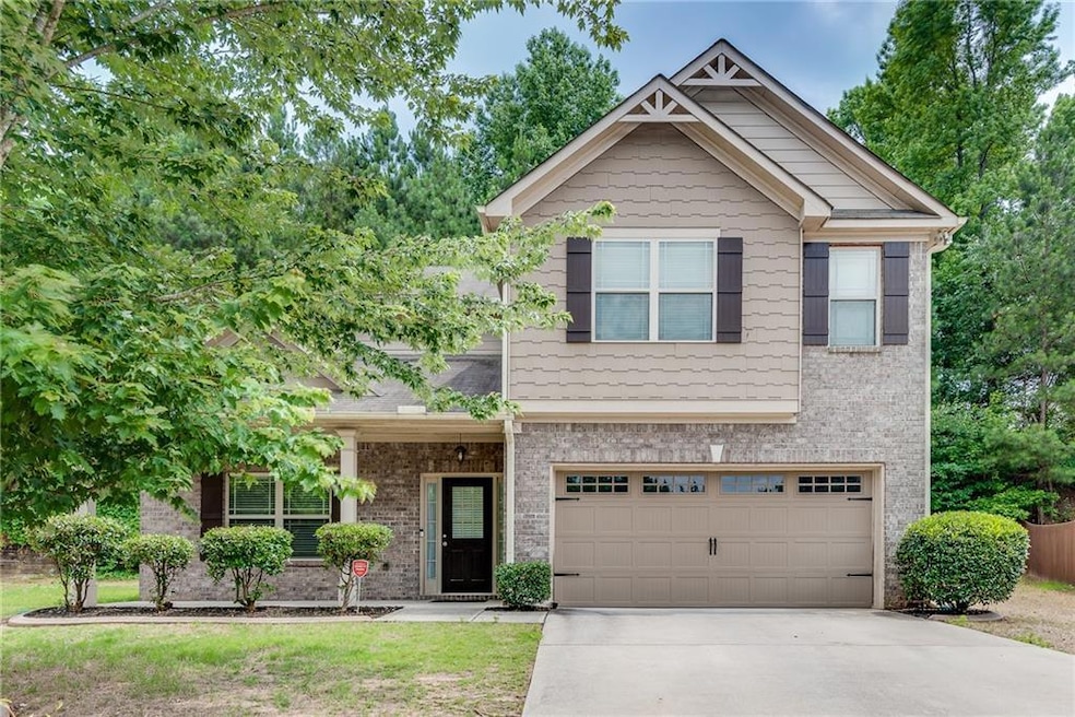 Brick Front House Featuring Front Covered Porch, Garage, Level Drive Way