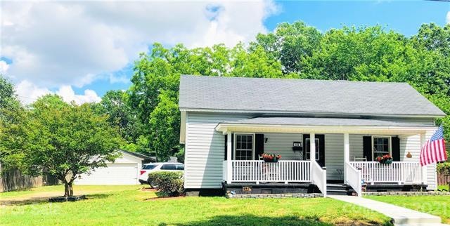 Front of home with separate 4 car garage