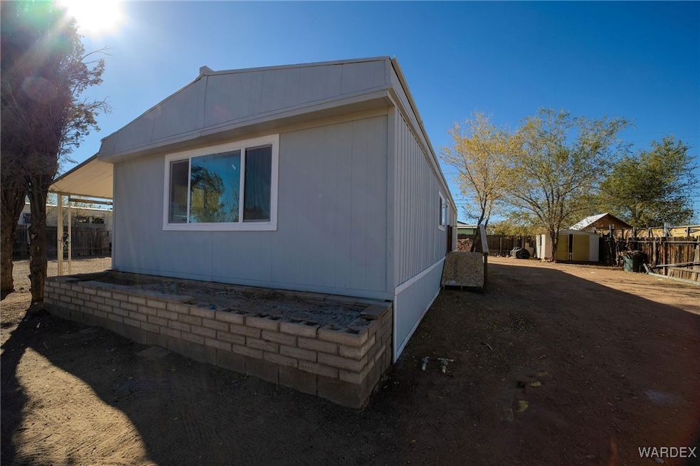 View of home's exterior with a storage shed