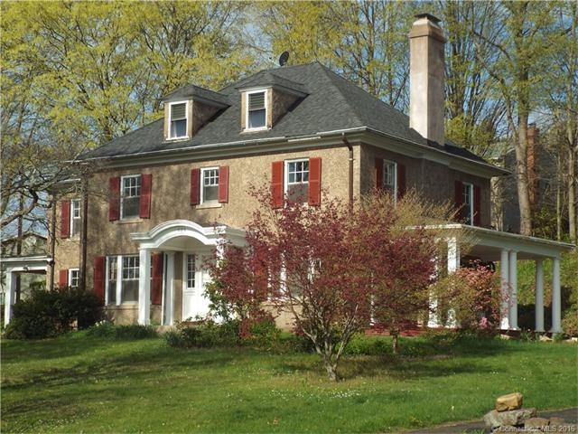 Front exterior -  gracious colonial set on a hill 