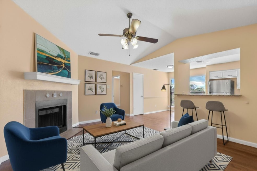 Living room with vaulted ceiling, dark wood finis
