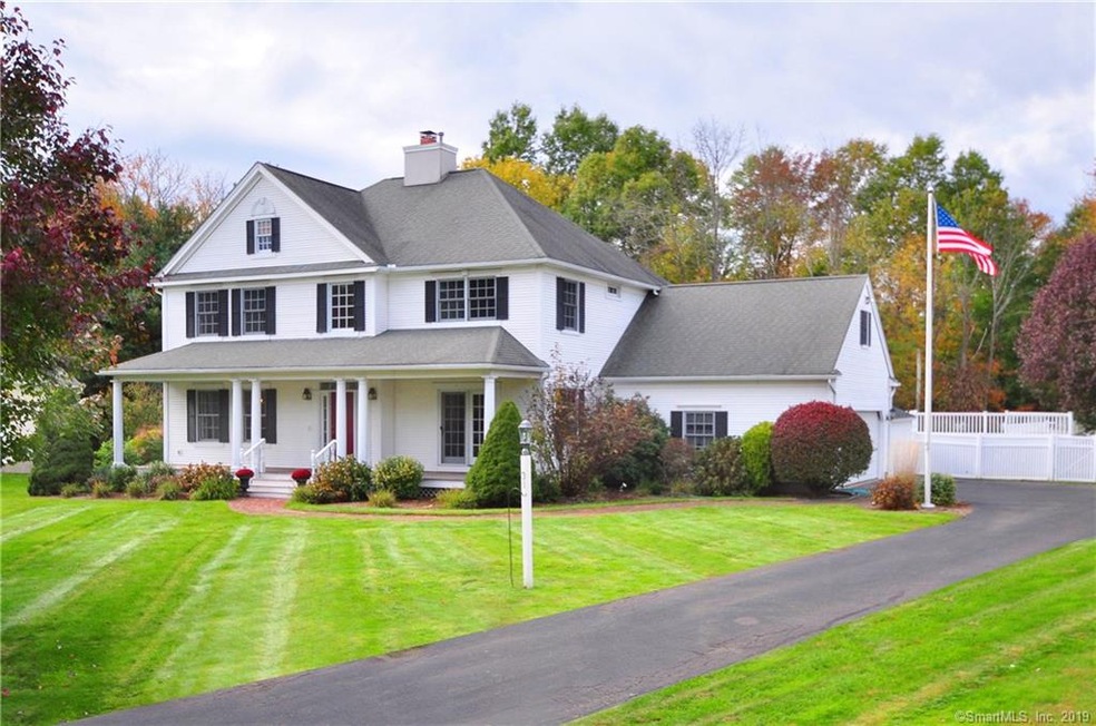 Exterior Front home with a mature lush manicured y