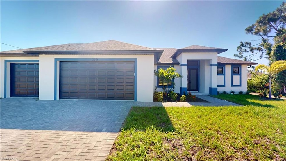 Prairie-style home with driveway, a front lawn, stucco siding, a garage, and a shingled roof
