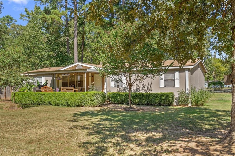 Wonderful home with newer front porch, almost acre