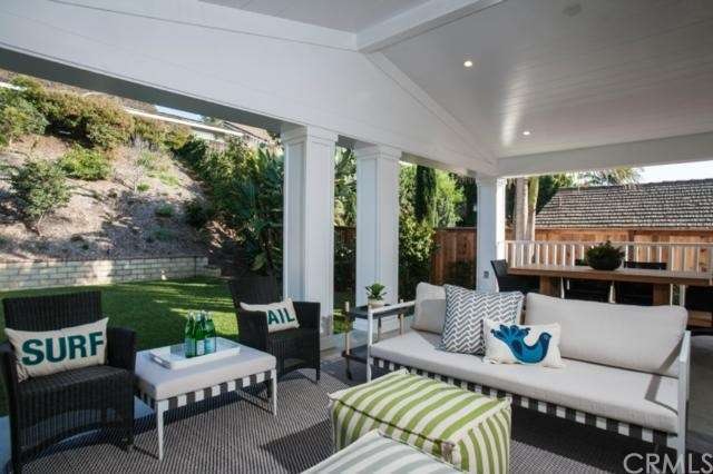 Amazing outdoor room under fully covered slatted w