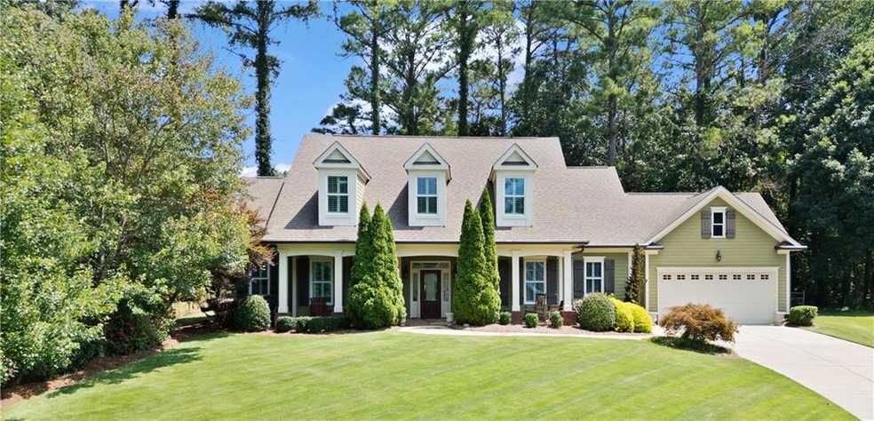 View of front of property with a garage and a fron