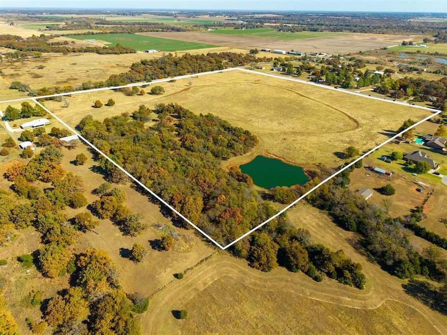 west View of rural area featuring property boundaries highlighted and a large body of water