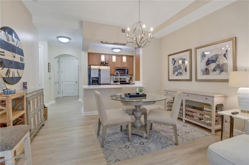 Dining room with a chandelier and light hardwood / wood-style floors