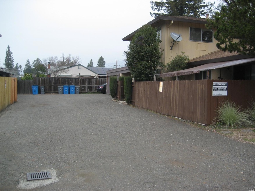 Driveway access to back parking area