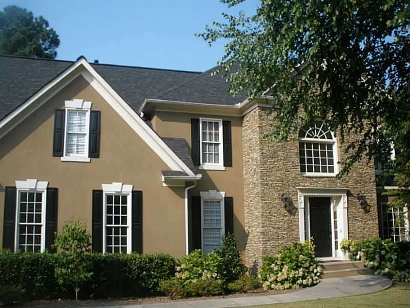 Exterior Front. Hardcoat stucco and extensive ston
