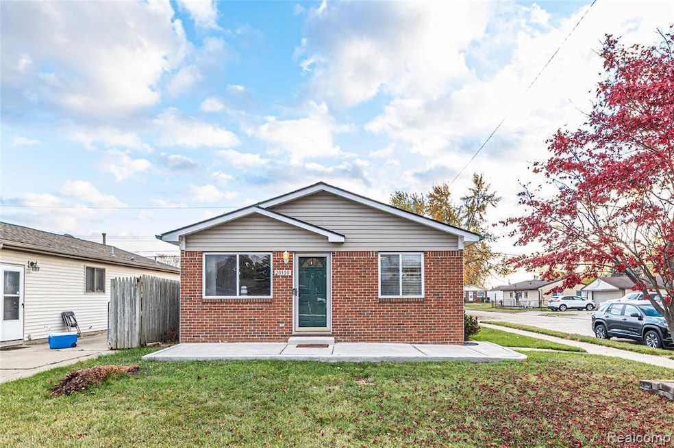 Bungalow-style house featuring brick siding and a patio area