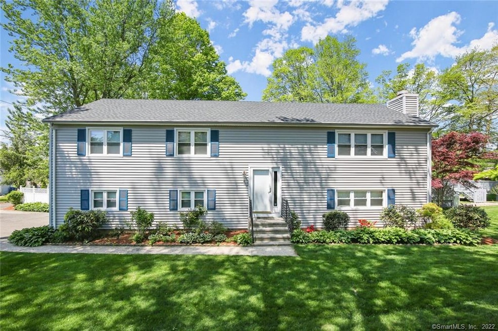 Front of the home with shady front yard.
