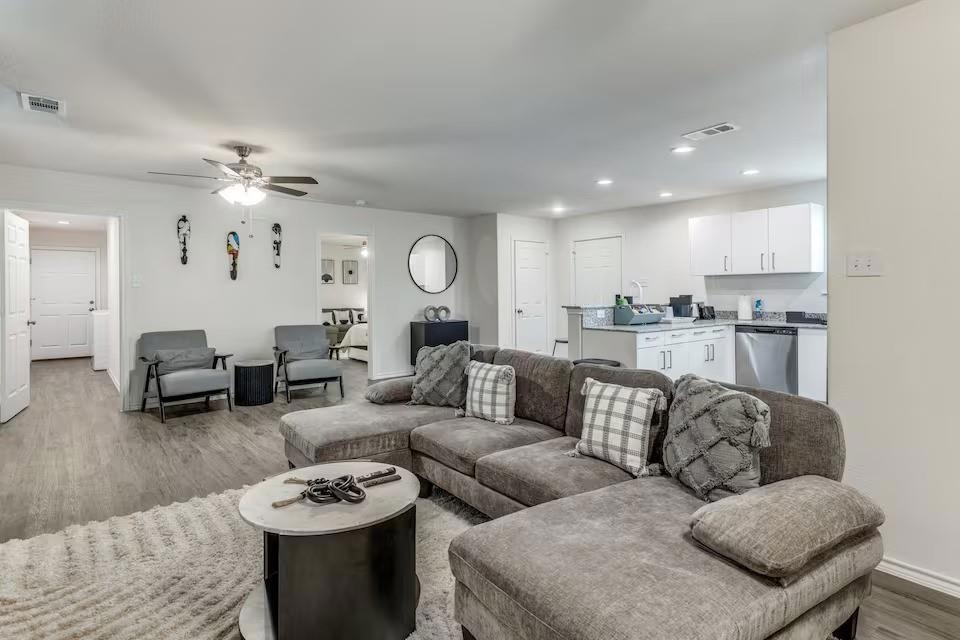 Living room with light hardwood / wood-style floor