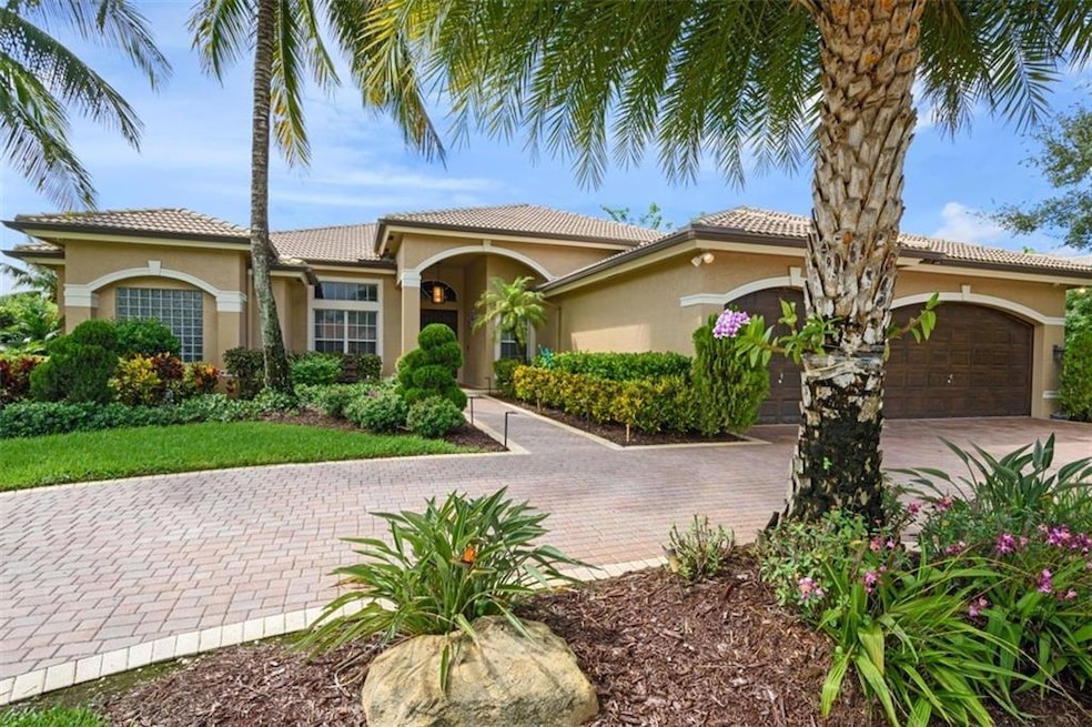 Three car garage and circular paved driveway