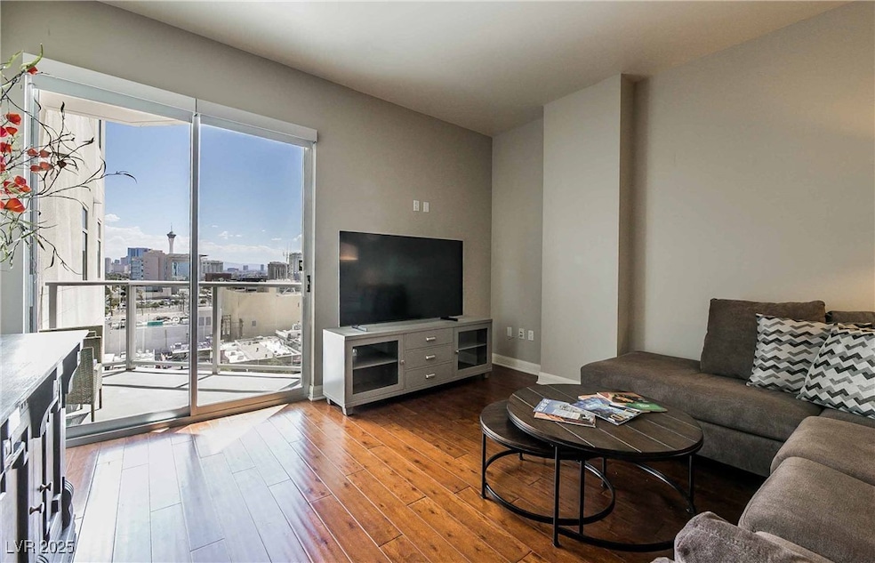 Living room featuring wood finished floors and bas
