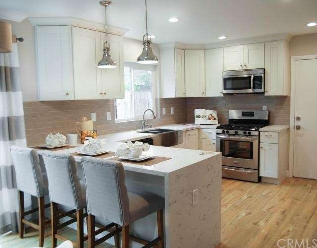 White Carrera Quartz Counters, stainless steel far