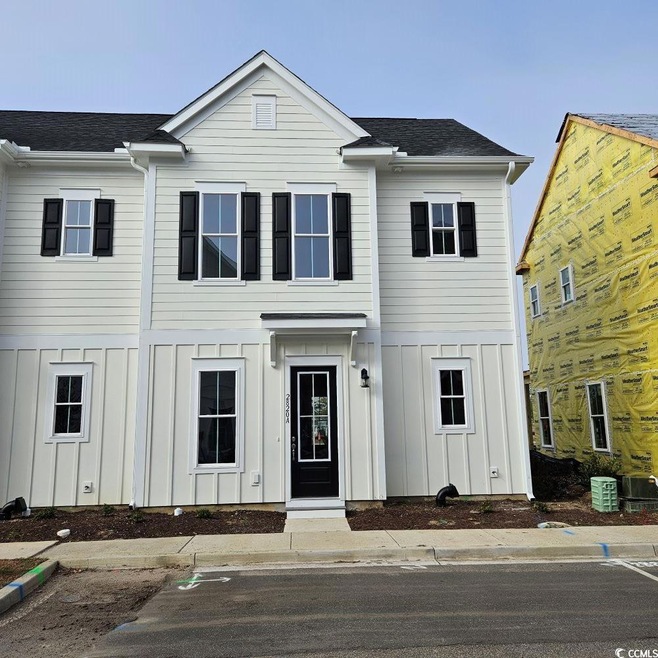 View of front of house with central AC