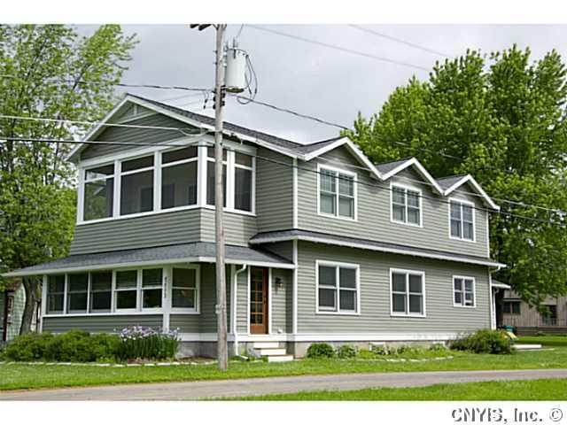 Exterior Front. Sited overlooking the St. Lawrence