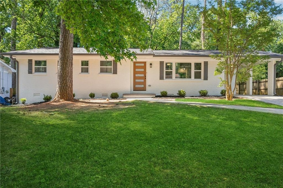View of front facade featuring crawl space and brick siding