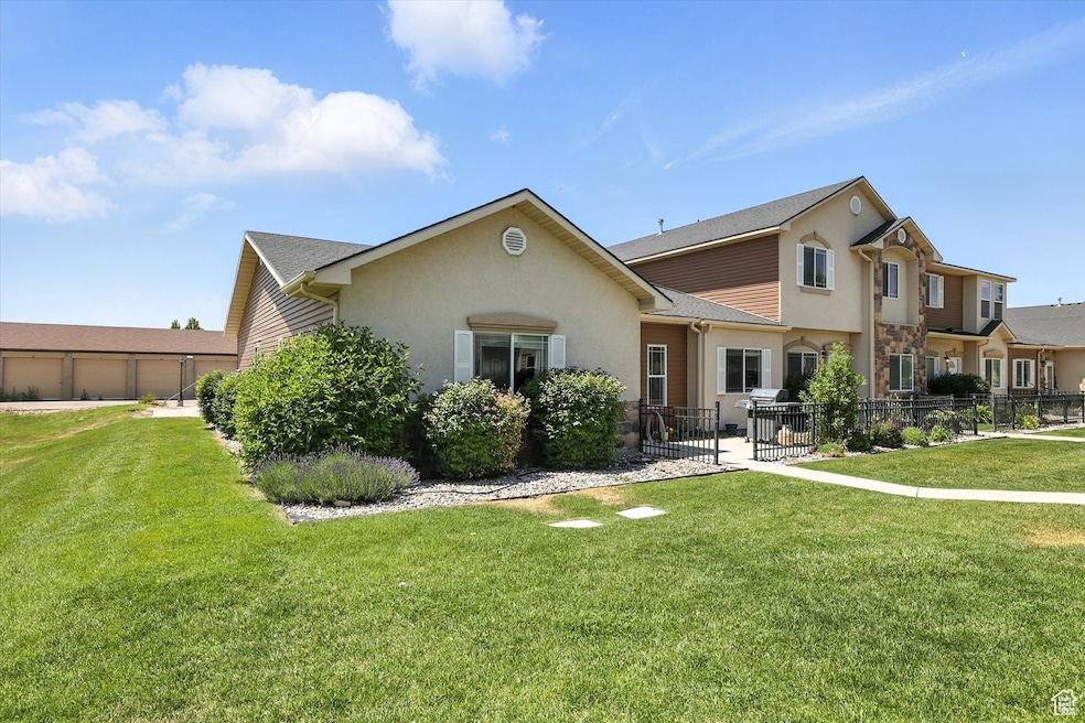 View of front of property featuring stucco siding and stone siding
