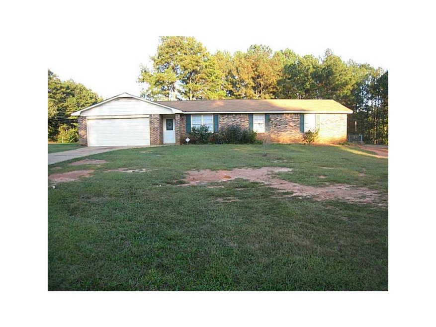 Exterior Front. Stepless entry four sided brick ho