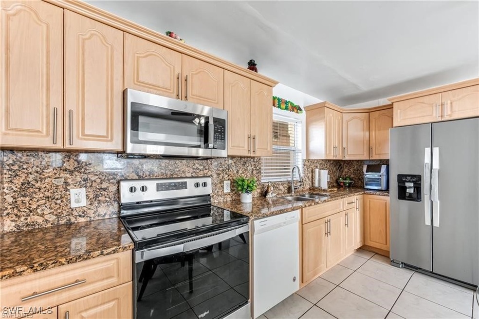Kitchen featuring stainless steel appliances, ligh