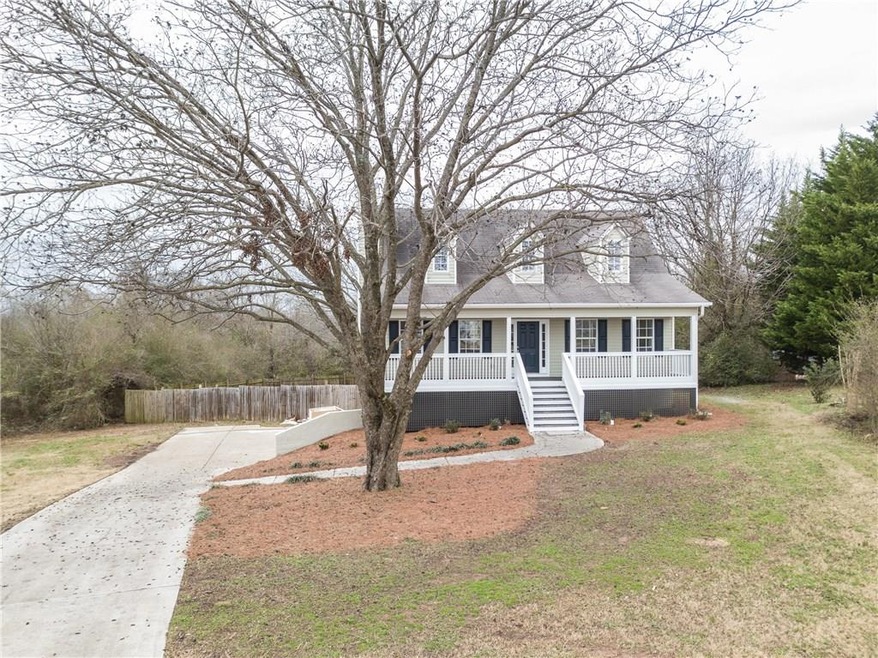 LOVE full-length front porch and great yard for pl